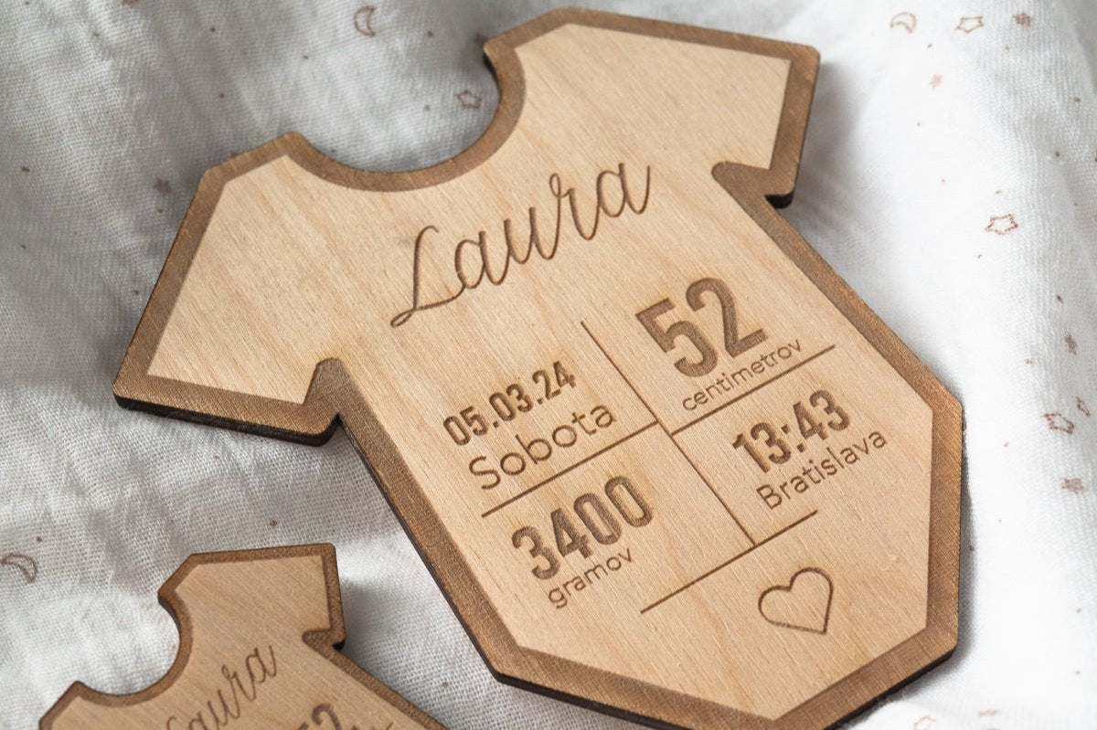 A wooden table with data on the birth of a child